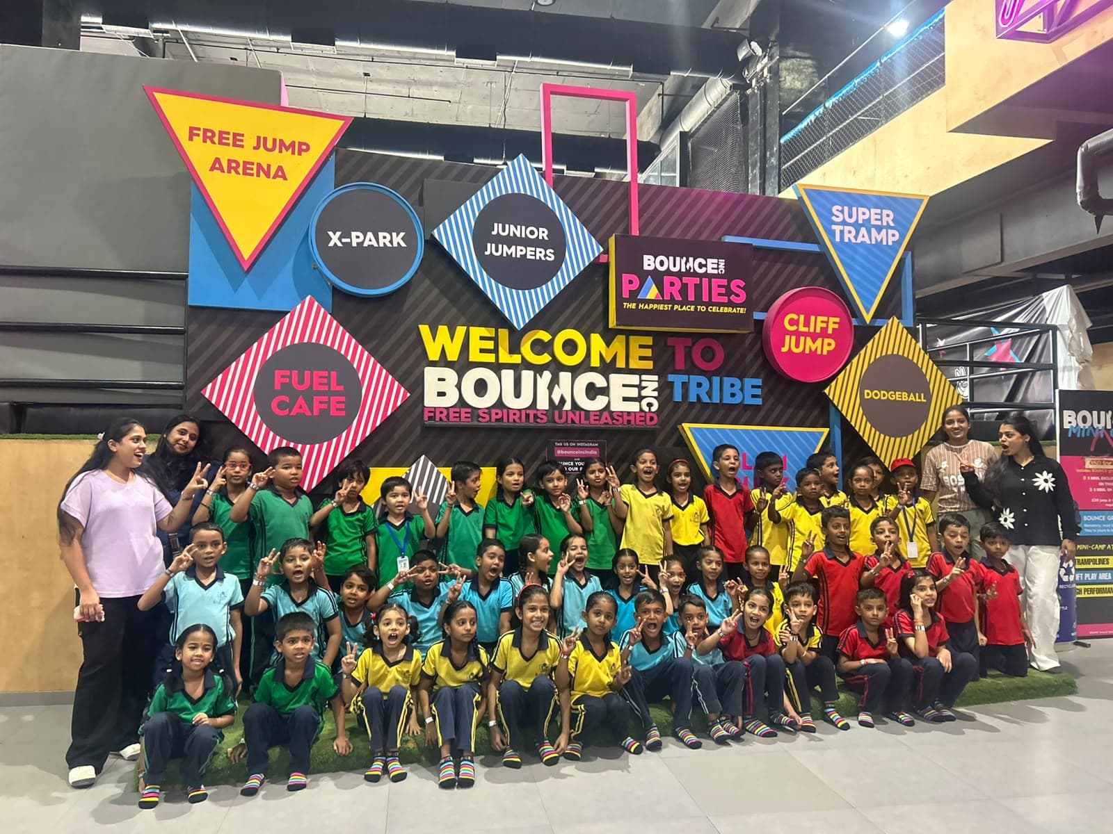 Students and teachers posing at Bounce trampoline park