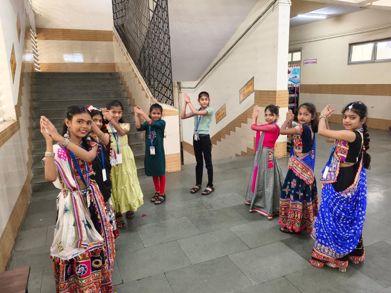 Students practising a cultural dance in traditional attire